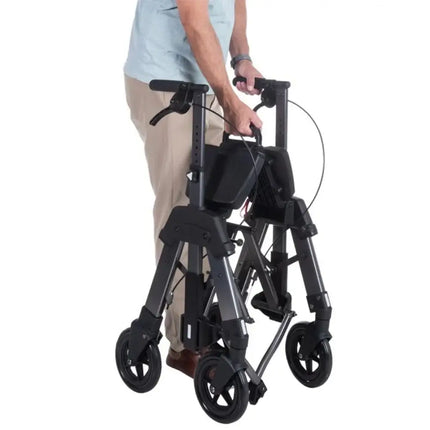 User folding the Heavy Duty EZ Fold and Go Rollator for easy transport and storage.