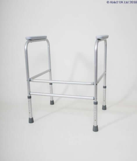 Aluminium toilet frame with adjustable height and armrests, designed for user support and stability.
