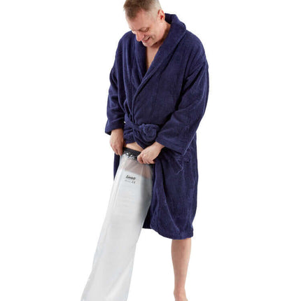 Man in a blue robe putting on a waterproof adult full leg protector for bathing and swimming.