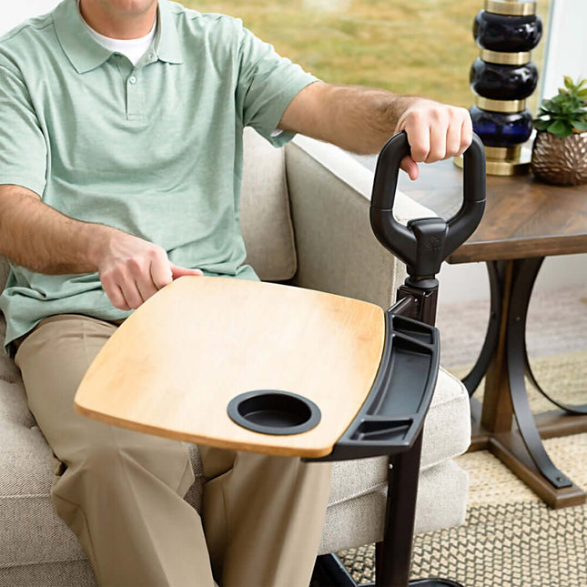 Man using Stander Assist-A-Tray with ergonomic handle and swiveling tray for easy support and convenience.