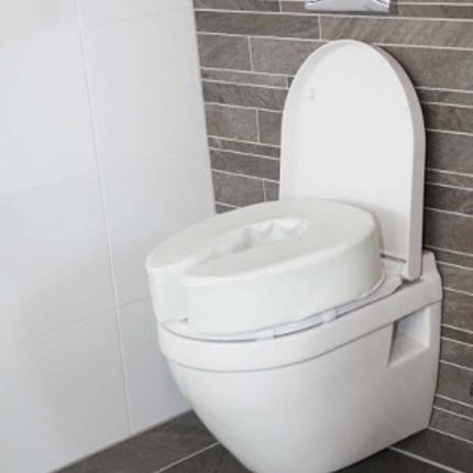Atlantis padded raised toilet seat on a modern toilet, providing comfort and ease for users.