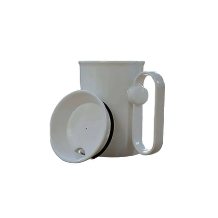 Handsteady drinking aid mug with a rotating handle for steady drinking, designed for ease and stability.