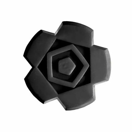 Close-up of a black rubber grip pad with a hexagonal and floral design.
