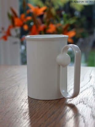 Handsteady drinking aid cup with innovative rotating handle for easy, steady drinking.