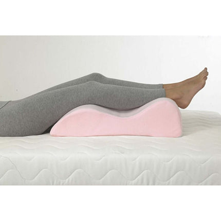Harley Leg Raiser providing ergonomic support for relaxing calves and relieving back pain on a bed.