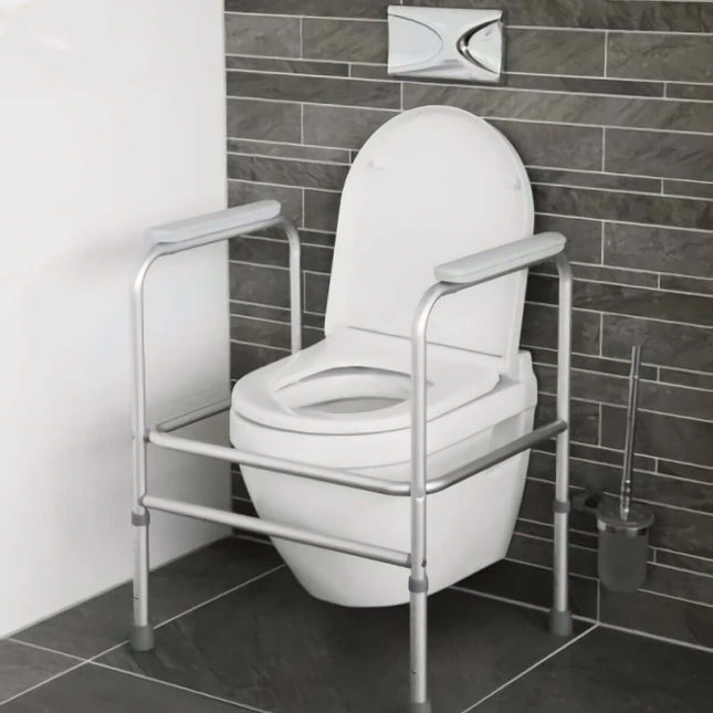 Lightweight aluminum toilet frame with armrests providing support around a lavatory for easier use.