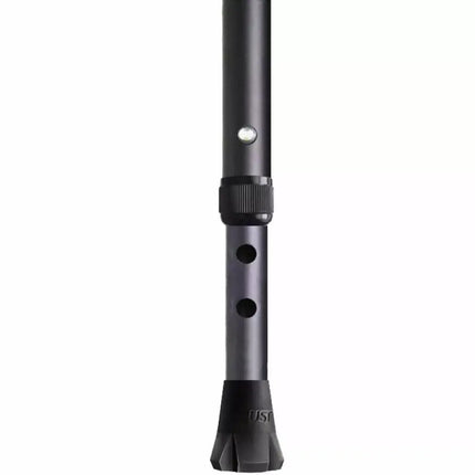 Close-up of adjustable black crutch with a rubber tip and locking mechanism for secure height adjustment.